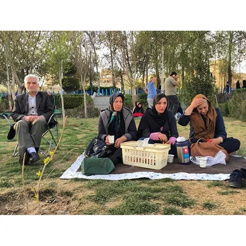 A family are enjoying the view of Zayanderoud on the rive