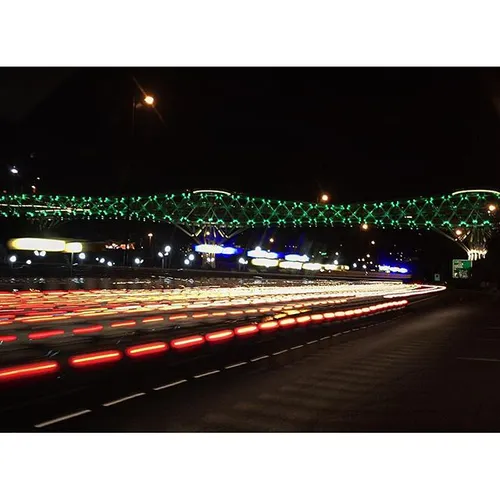 Light trails on Modarres and the Tabiat bridge glowing in