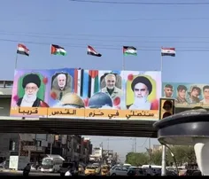 نصب پلاکاردی از عکس‌های #امام_خمینی، #رهبر_انقلاب، #شهید_