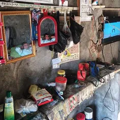 A farmer rests and and watches television in his room in 