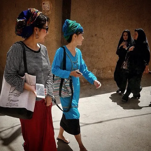 Chinese tourists visiting the old part of Yazd, Iran. Pho