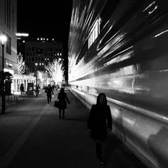 Pedestrians making their way on a street of Wakashiba are