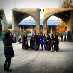 Students taking a photo in front of the University of #Te