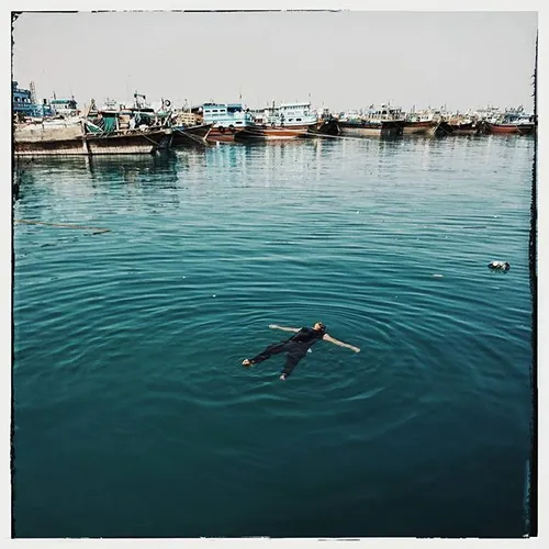 Launch (boat) fisherman relax into the water of Persian G