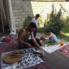 Male members of a family make Kabab at the house yard. #G