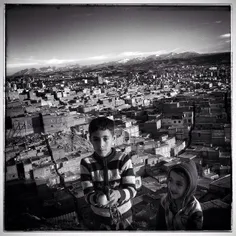 Mahdi (10) and Ali (6) with their duck posed for me with 