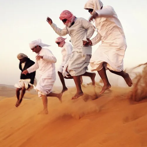 Jumping around on the dunes of the Sharqiya Sands, Oman. 