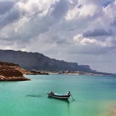 A man preparing his boat for visitors who want to sail ac