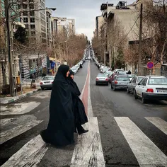 Women crossing over a street. #Tehran, #Iran. Photo by Ab