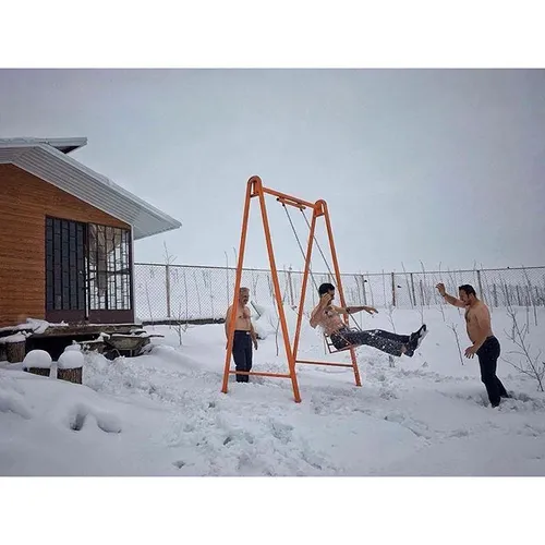 Men enjoy themselves on an snowy spring day. Tabriz, East