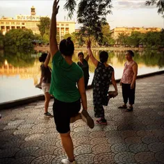 The elderly doing physical exercise in the morning by Hoa