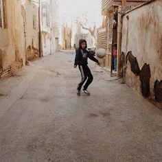 A boy plays with a ball in a narrow alley. #Mashhad, #Raz