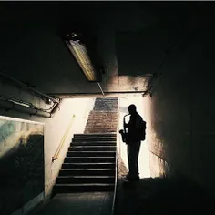 A busker plays Billy Joel's "Piano Man" in a subway. #cap