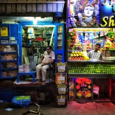 Indian shopkeepers wait for customers in the old quarters