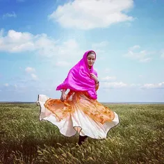 A nomadic girl in traditional costume dances in Mugan pla