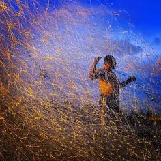 A fisherman smoothes his net on Ulheulheu beach, in Aceh 