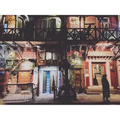 A woman seen standing outside a cafe called "Cooco's Den"