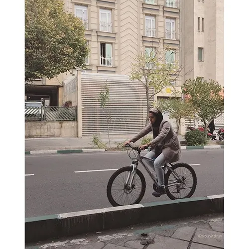 A young girl is riding a bicycle. | 24 Nov '15 | iPhone 6