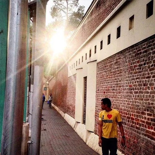 A Nepalese man walk on the road side of Thamel, one of th