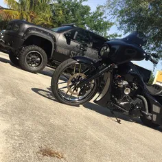 Supercharged Harley street glide next to the custom built