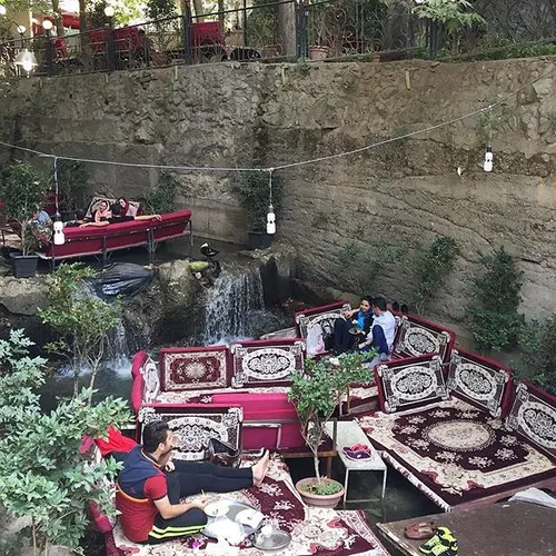 People spend their leisure time at Darband, a popular att