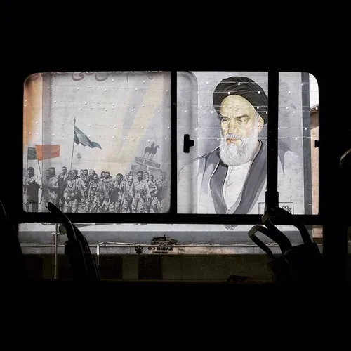 A mural portrait of Ayatollah Ruhollah Khomeini, the foun