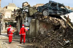 بابانوئل در عراق برای دادن هدیه به بچه های جنگ زده و محرو