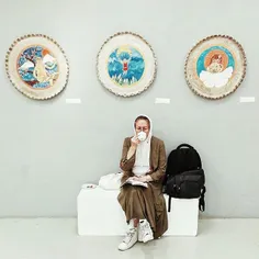 A woman, whose artwork is exhibited in one of the galleri