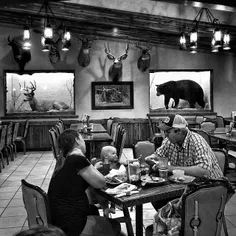 A family eats dinner at a truck stop restaurant in Belfie