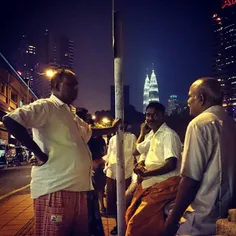 A group of Indian migrants having light chat. The Malaysi