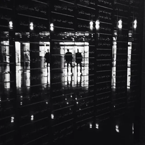 Photo by @alexkpotter - Two men are reflected in the memo