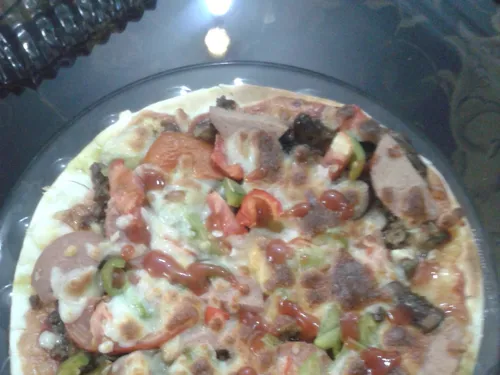 بفرمایید پیتزا تازھ خودم درست کردم