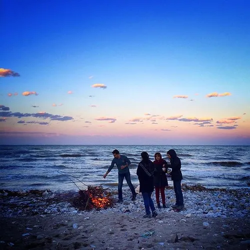 A family makes a fire by the CaspianSea. Mazandaran, Iran