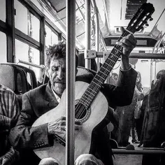 A man plays the guitar in a public bus. #Tehran, #Iran. P