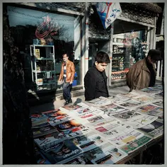 People reading newspapera on the street of Tabriz, Iran i