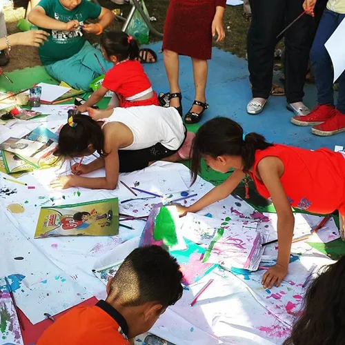 Kids participate in a drawing activity at (I'm Iraqi, I r