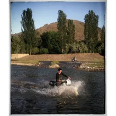 Local boys riding their motorbikes in Ghalechai river in 