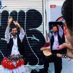 Street dancer being photographed, Istanbul, Turkey. Photo