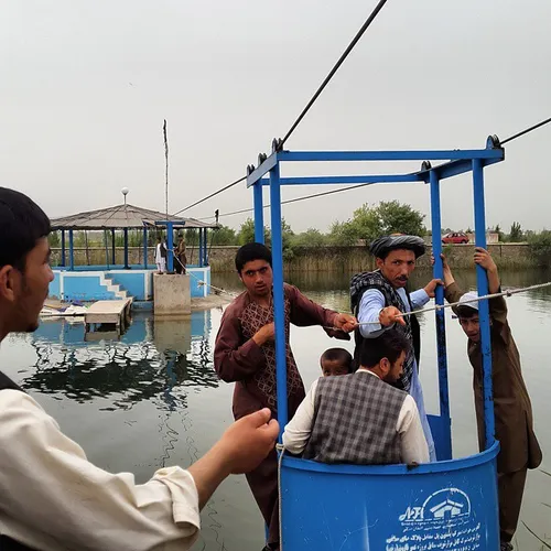 On a Friday afternoon, a group of afghan men ride a chair