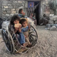 Palestinian refugee children play in front of their house