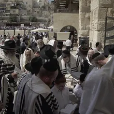 Jews pray in front of the Western Wall in the Old City of