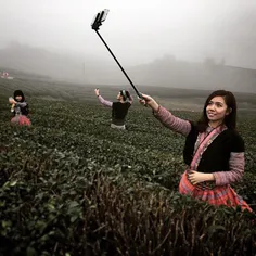 Tourists take selfies on traditional Thai minorities dres