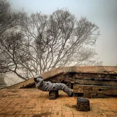 A Nepalese man does his morning workouts near Pashupatina