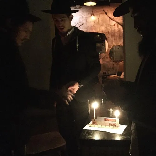 Orthodox Jews light khanukkah candles in a bar in Tel Avi