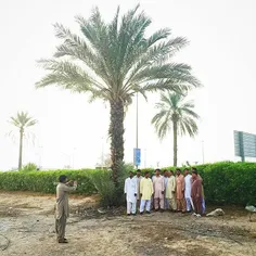 Pakistani expatriates pose for a group photo on Eid-Al-Fi