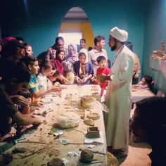 A Muslim cleric teaches kids how to make things out of mu