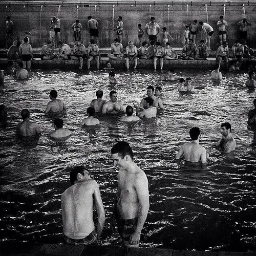 Men swimming in Gavmish-Goli Warm Mineral Spring, located