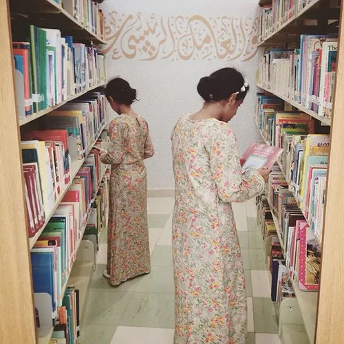 Sisters at the library in Abu Dhabi, UAE. Photo by Sarah 