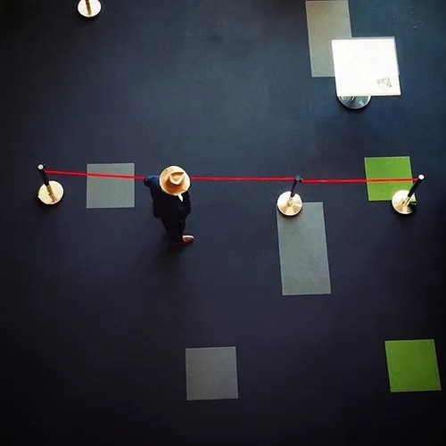 A man talks on the phone in the hall of Charsou Cinema Co