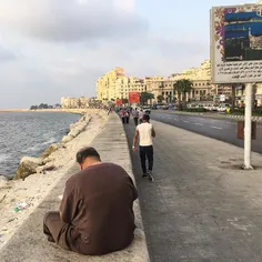 A man reads the newspaper on the Alexandria corniche in #